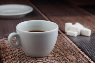 White coffee cup sugar cubes on table.Coffee time
