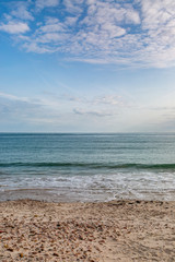 Looking out to sea over a sandy beach, on the channel island of Jersey