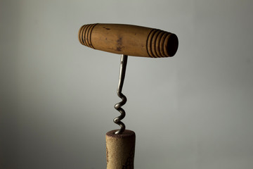 old corkscrew and cork in action