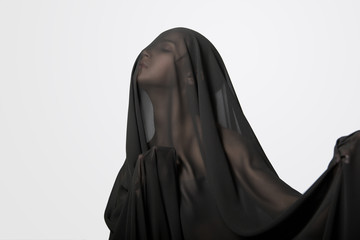 Girl in a black transparent veil on the face. Conceptual portrait in the studio. Minimalism.