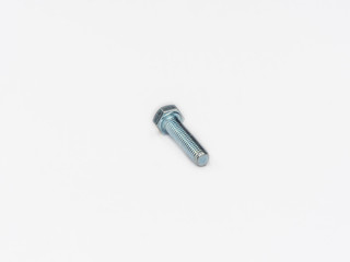 Zinc plated tap hexagonal metric screw bolt din 933 on white.