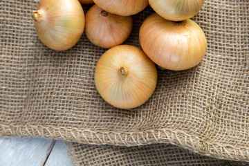 onions background with burlap sack