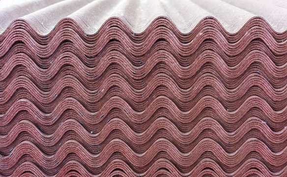 Sheets of brown ondulin. Slate to cover the roof of the house. Background from ondulin.