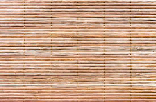 Rug of wooden slats. Background and texture of wooden mat.