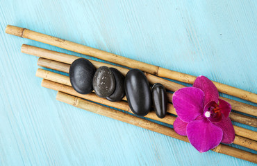 spa concept with zen basalt stones and orchid