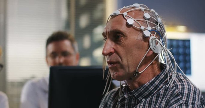 Patient answering doctors questions during brain scan