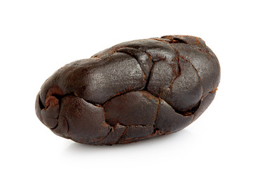 Single roasted peeled cocoa bean isolated on white.