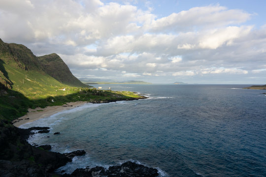 Landscapes of the windward shores of Hawaii Oahu, Rabbit Island cliffs, blue sky bold images of the ocean and the shores of Hawaii