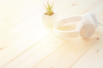 Headphones on wooden desk table