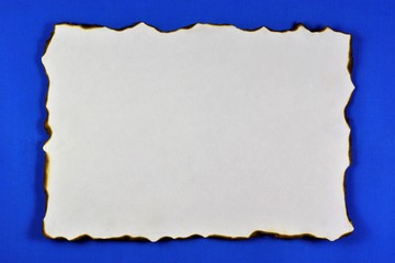 The ancient texture of old paper, the background for the creativity of writing. Vintage grunge paper with dark edges, blue background for literary composition, language education and library.