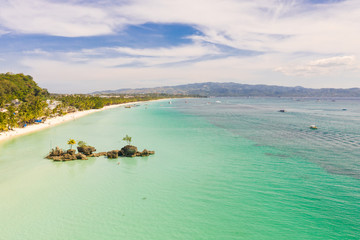 White sand beach and lagoon with turquoise water, aerial view. Coast of the island of Boracay, Philippines. Boracay island Grotto, Willy's Rock,