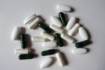 Top view of pills of multivitamins, calcium and magnesium