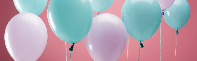 bright party multicolored balloons on pink background, panoramic shot
