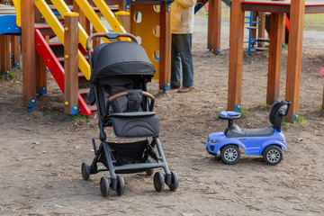 Beautiful baby carriage in the park. New design.