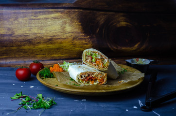 Homemade shawarma / burrito / chicken roll with vegetables and sauce. Top view ingredients