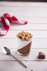 Delicious breakfast, cocoa chia pudding with yogurt and cereals