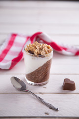 Delicious breakfast, cocoa chia pudding with yogurt and cereals