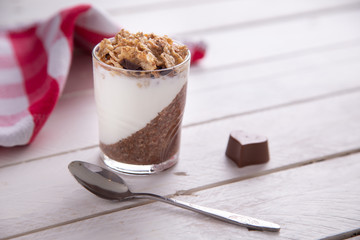 Delicious breakfast, cocoa chia pudding with yogurt and cereals