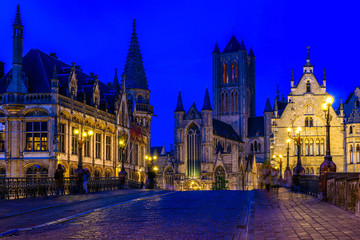 Fototapeta na wymiar Medieval city of Gent (Ghent) in Flanders with Saint Nicholas Church and Gent Town Hall, Belgium. Nigth cityscape of Gent.