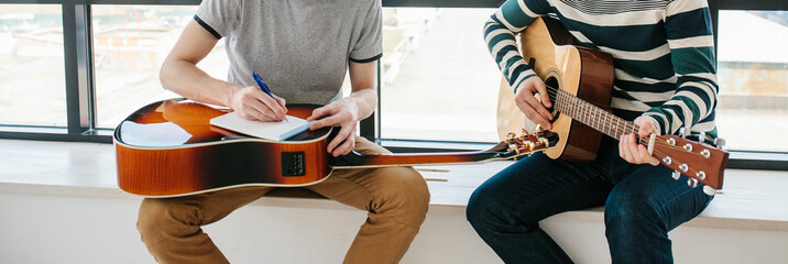 Learning to play the guitar. Extracurricular activities or tutoring or hobbies or creative...
