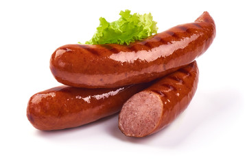 Grilled bratwurst Pork Sausages with lettuce, close-up, isolated on white background