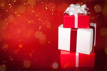 Stack of red and white Christmas Gift Boxes on Red Background