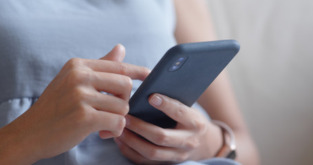 Close up woman use of smart phone at home