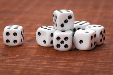 Dice on wooden table. Background for casino games.