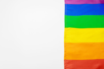 Rainbow gay flag on white background close up
