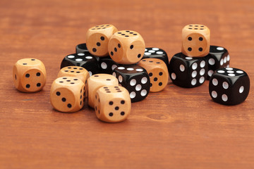 Dice on a wooden table. Concept for business risk.