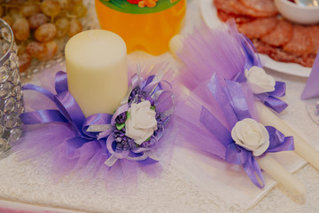Beautiful wedding candles on the table to light the hearth.