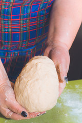 Knead the dough with your hands on the table