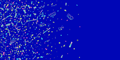 Colorful colored confetti on a blue background.