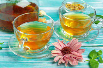 healthy herbal tea over blue background