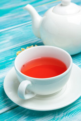 healthy herbal tea over blue background