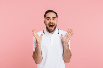 Portrait of an excited bearded man standing