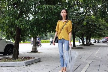 woman with umbrella in town