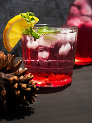 Red nectar with a mixture of soda and lemon, a cold drink on the table