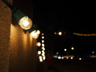 Small yellow light bulbs decorated on public walls