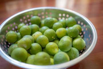 Focus and Blur on Green lemon lime or Thailand lemons on metal basket. Abstract of sweet, sour flavor and Thirsty.