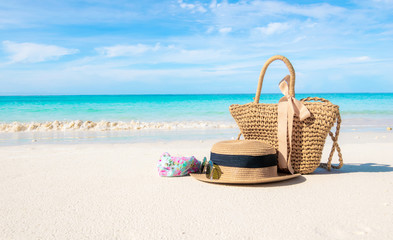 Hats and glasses placed on the beach and sea have a holiday summer relaxing and travel bright sky koh lipe thailand