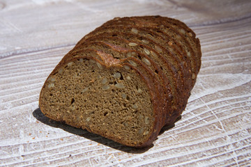 rye bread with seeds on a wooden table