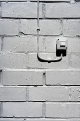 Electrical switch on the white wall