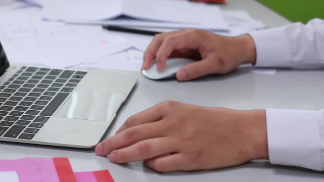 Businessmen working in the office, using computer searches new job on internet. Business concept.