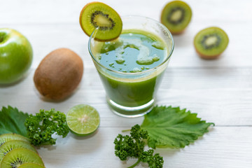 Healthy Juice. Green smoothie, Organic and Fresh green vegetable for detox, diet and weight loss on wood white background.  Healthy Concept