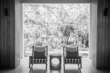 Modern contemporary style rocking chairs with table garden view
