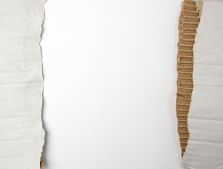 torn piece of paper from under the box in half on a white background