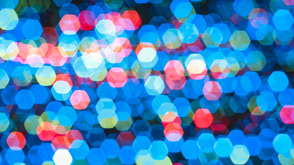 Abstract colorful bokeh light on dark background. Christmas and New Year theme