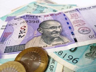 Indian currency two thousand one hundred rupee note and coins