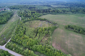 Aerial photography with a drone. Landscape with a road and a field.